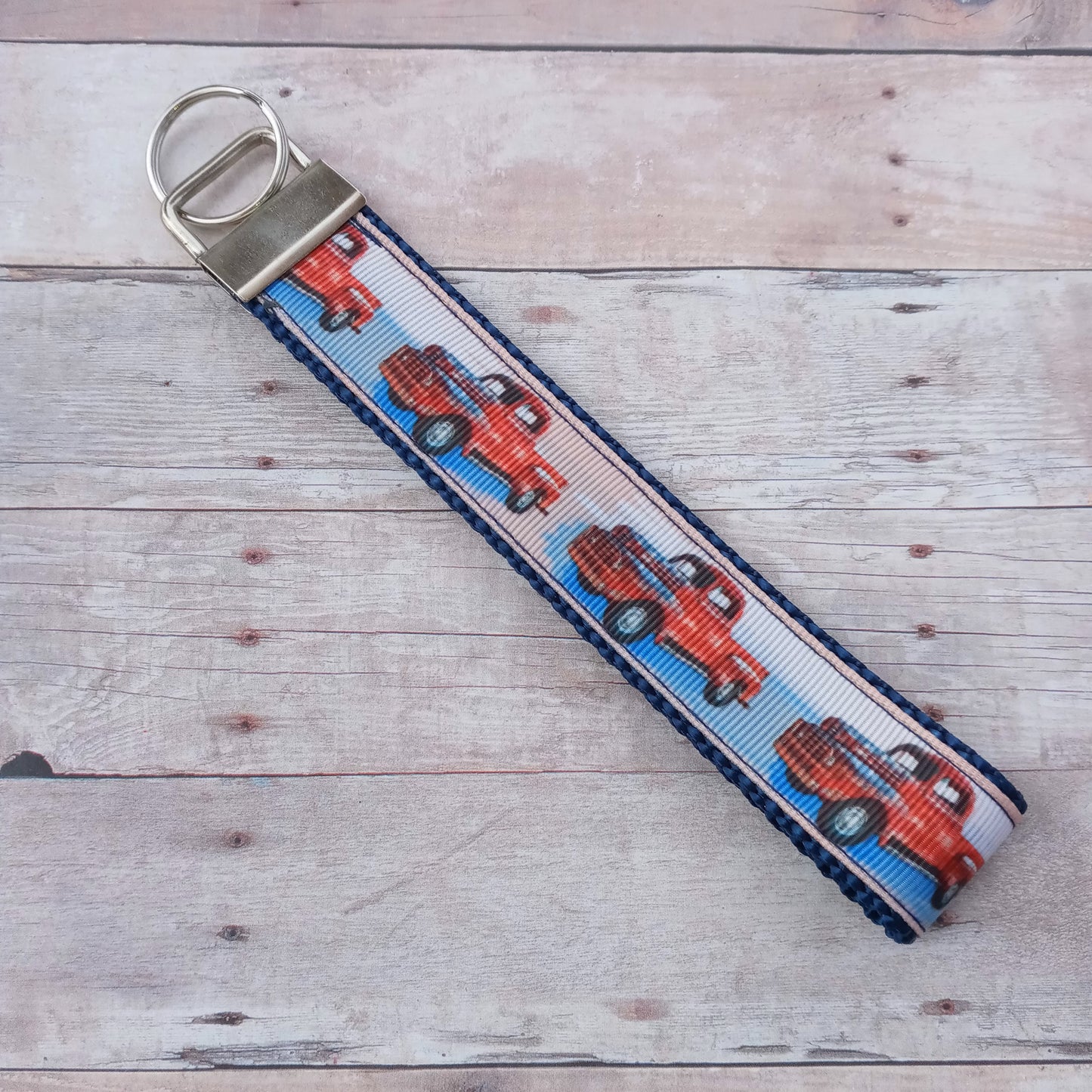 Red pickup on blue webbing keychain 6"