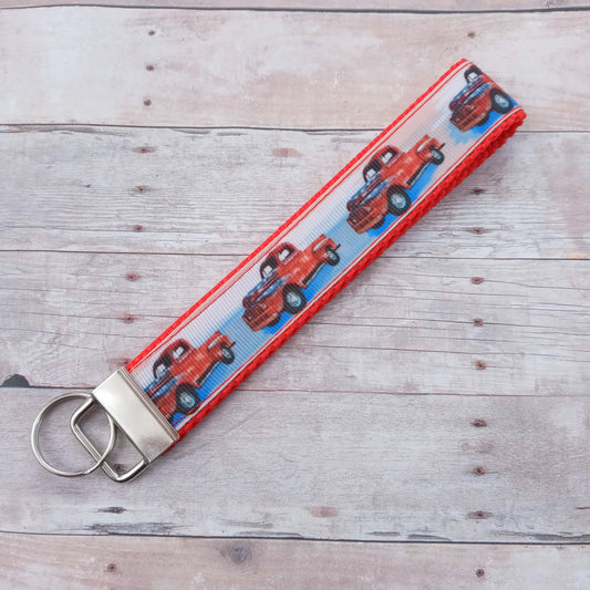 Red pickup truck on red  webbing keychain 6"