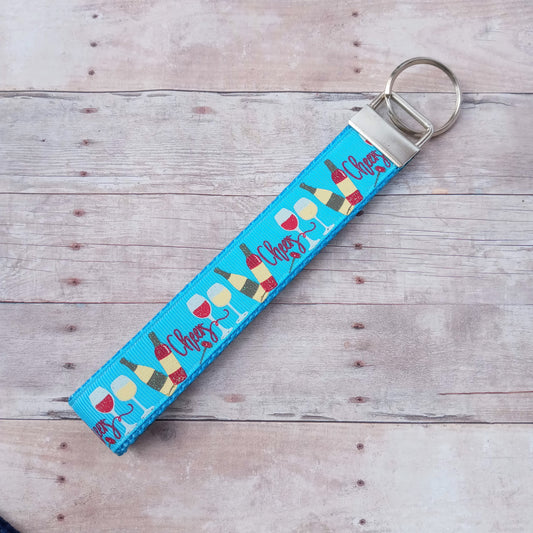 Cheers, wine glass, wine bottle on blue webbing keychain 6"