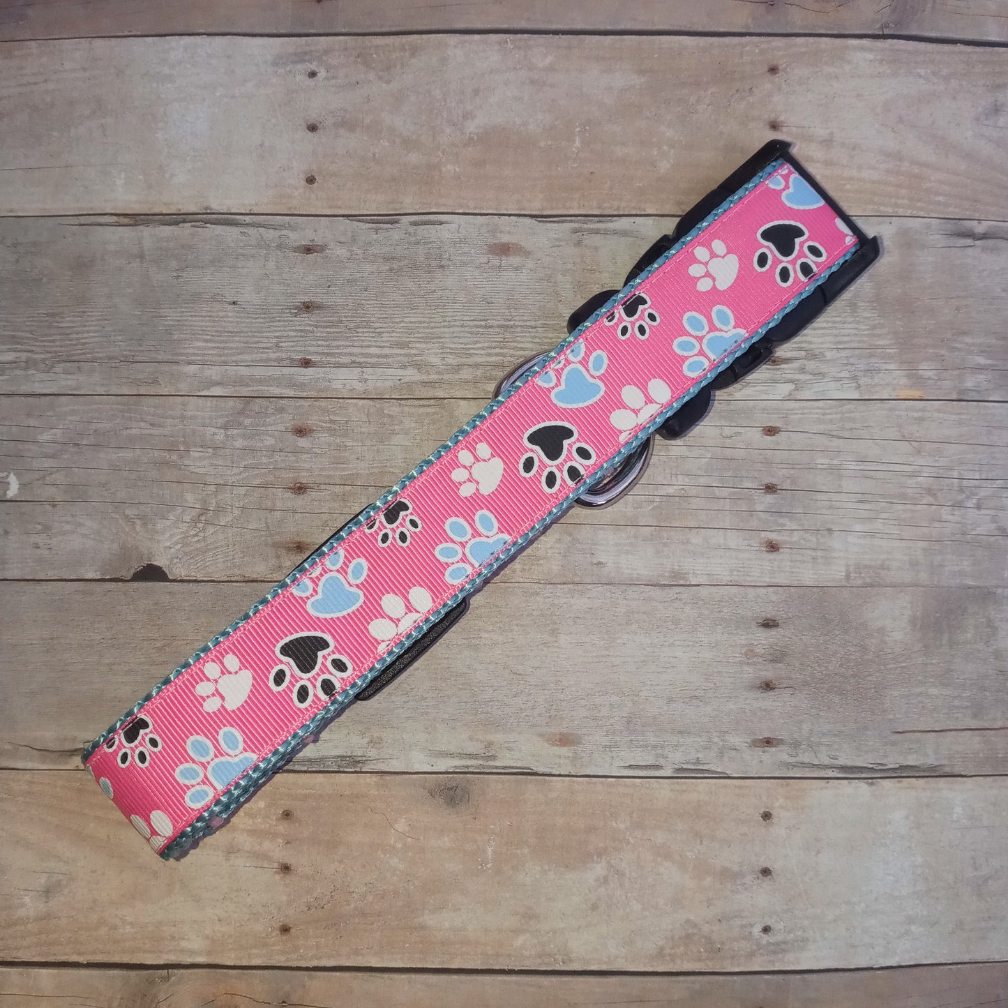 Paw prints on pink dog collar