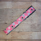 Paw prints on pink dog collar