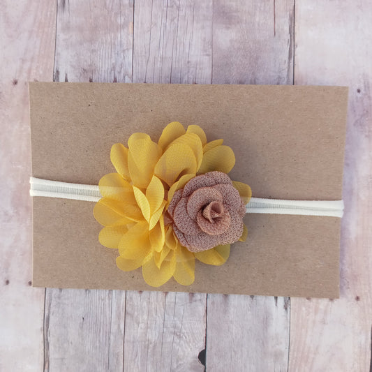 Mustard yellow and brown flowers on ivory nylon headband.