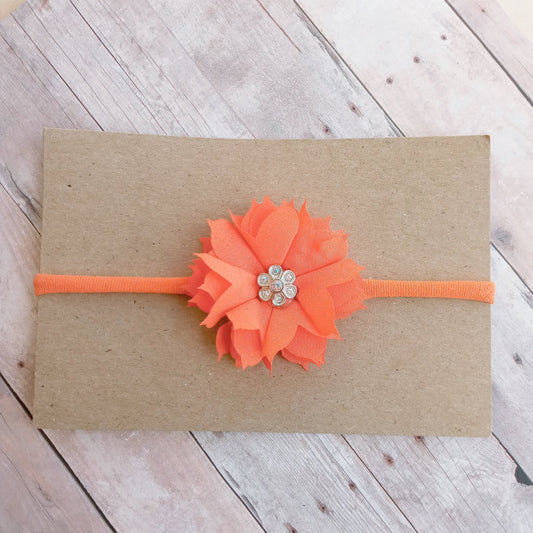 Orange flower on orange nylon headband