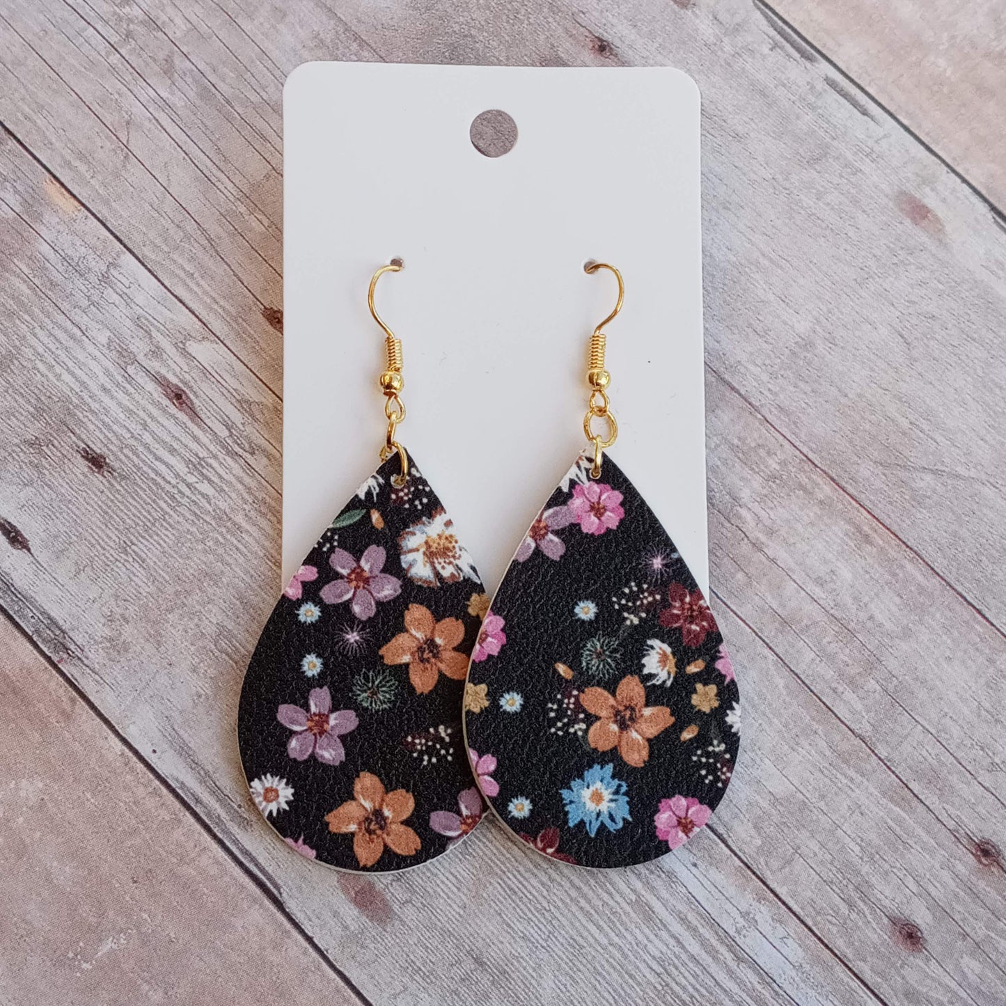 Floral on black 2" dangly earrings